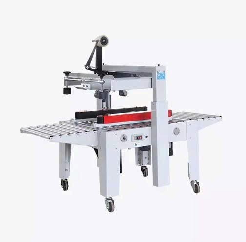 máy dán băng keo thùng carton bán tự động hualian fxj-5050a (dùng băng keo bopp) hình 0 may dan bang keo thung carton ban tu dong hualian fxj-5050a (dung bang keo bopp) hinh 0